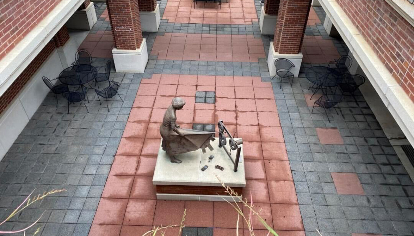 red brick courtyard with girl statue