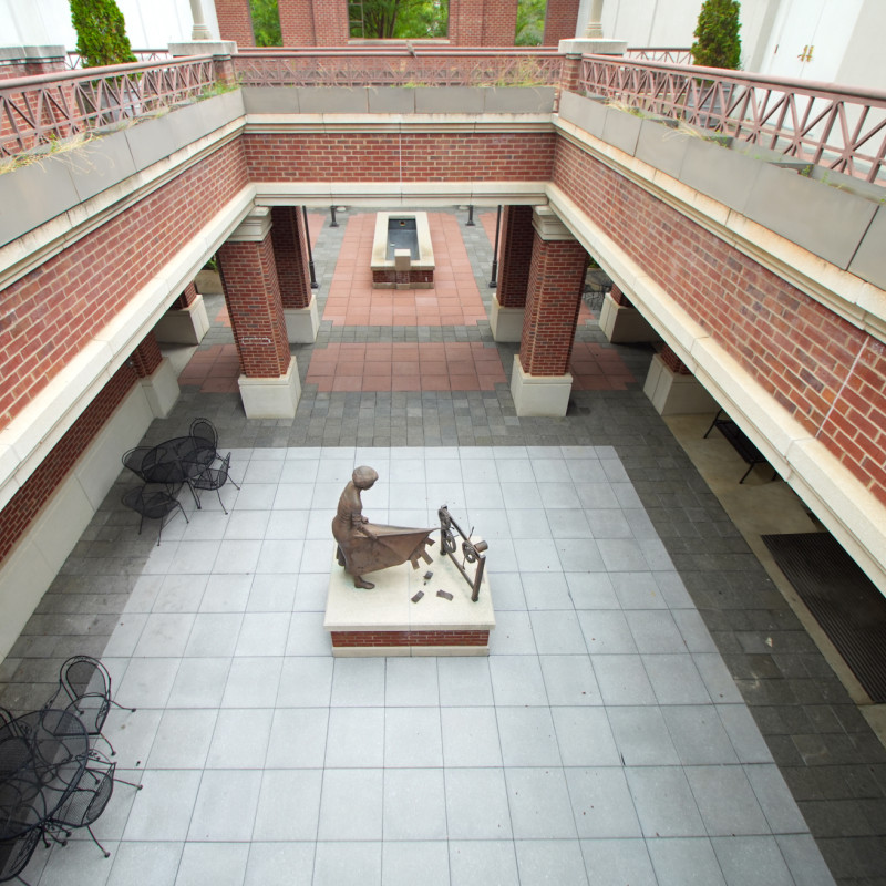 red brick courtyard with new stone floor