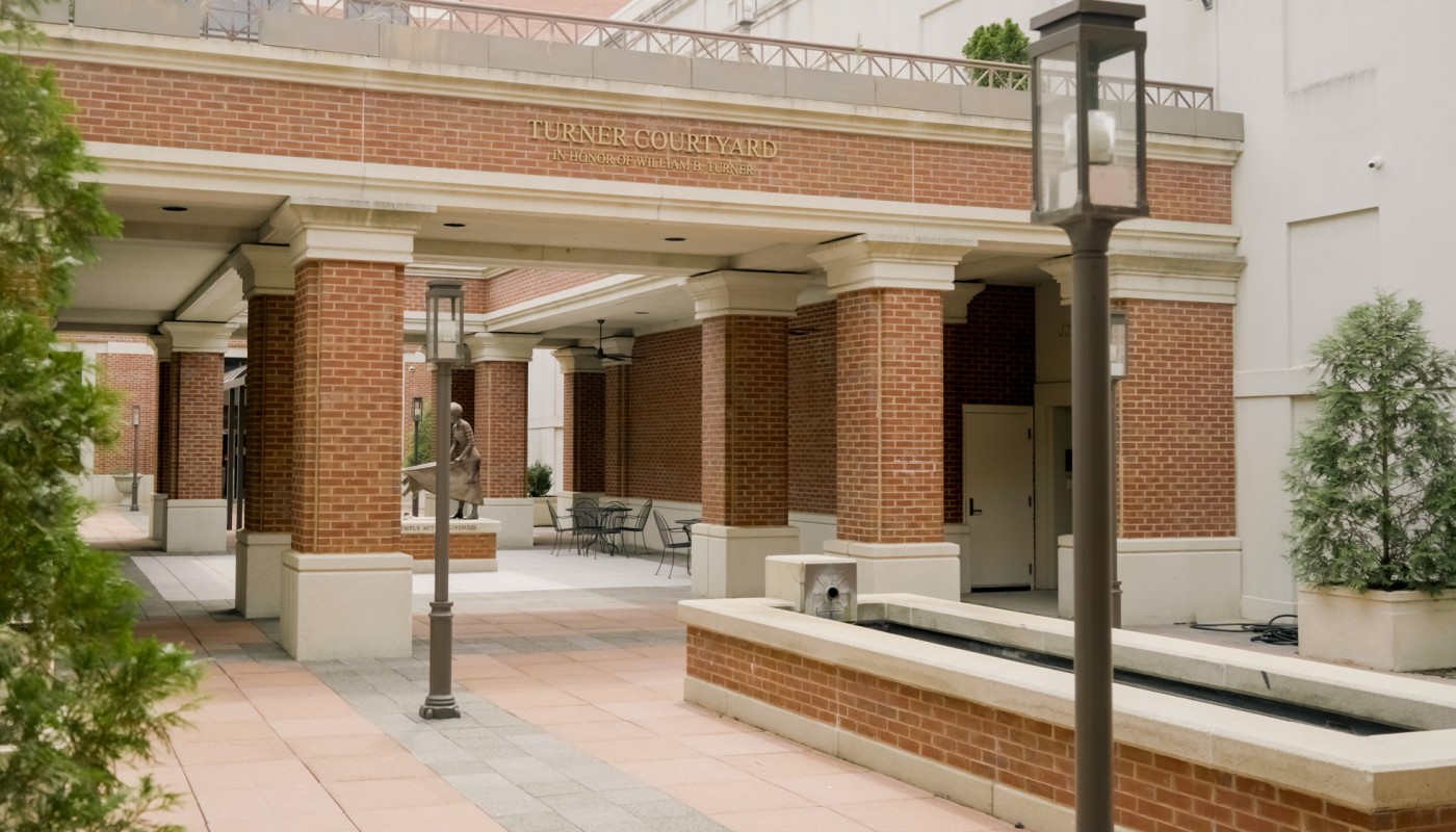 red brick courtyard with street lamps