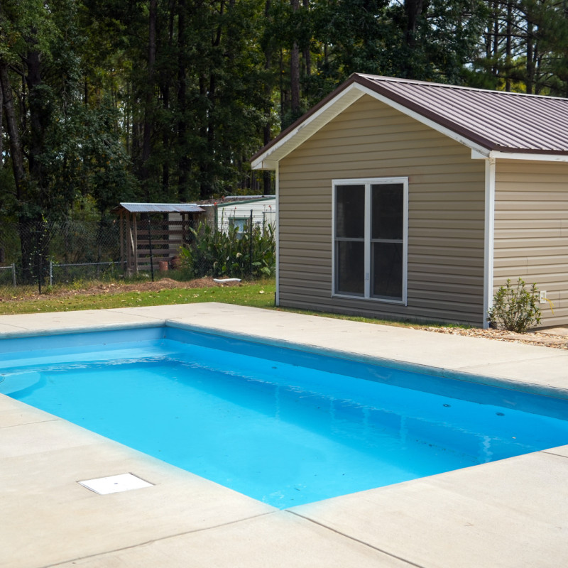 rectangle pool with poured patio